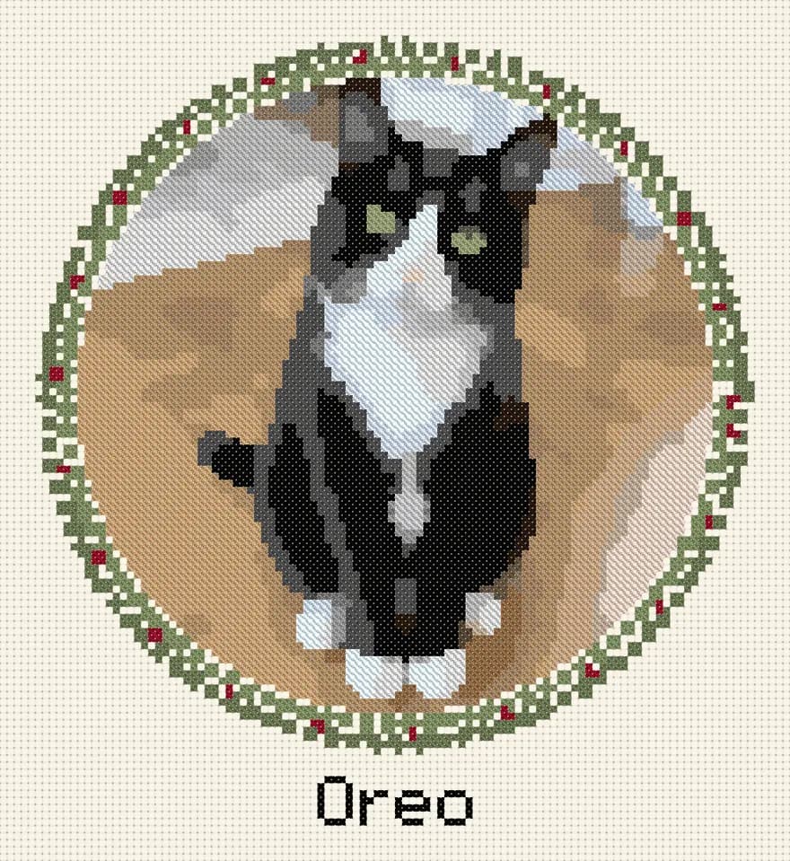 Cross-stitch pattern of a tuxedo cat named Oreo in a round wreath
